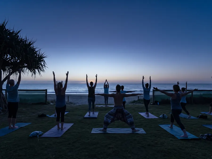 A sunrise movement session on the grass above the beach