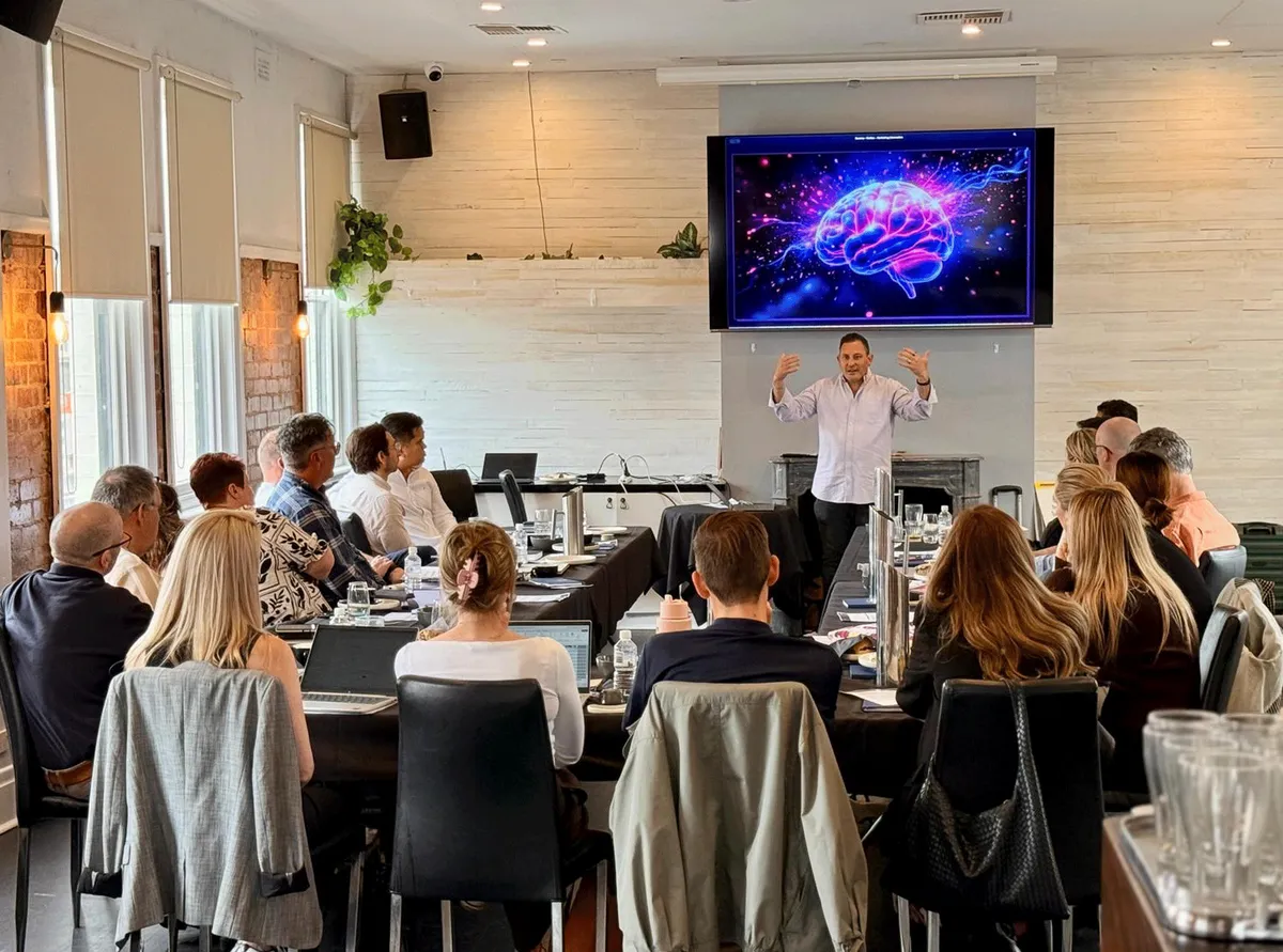 Justin Kabbani working with a room of executives
